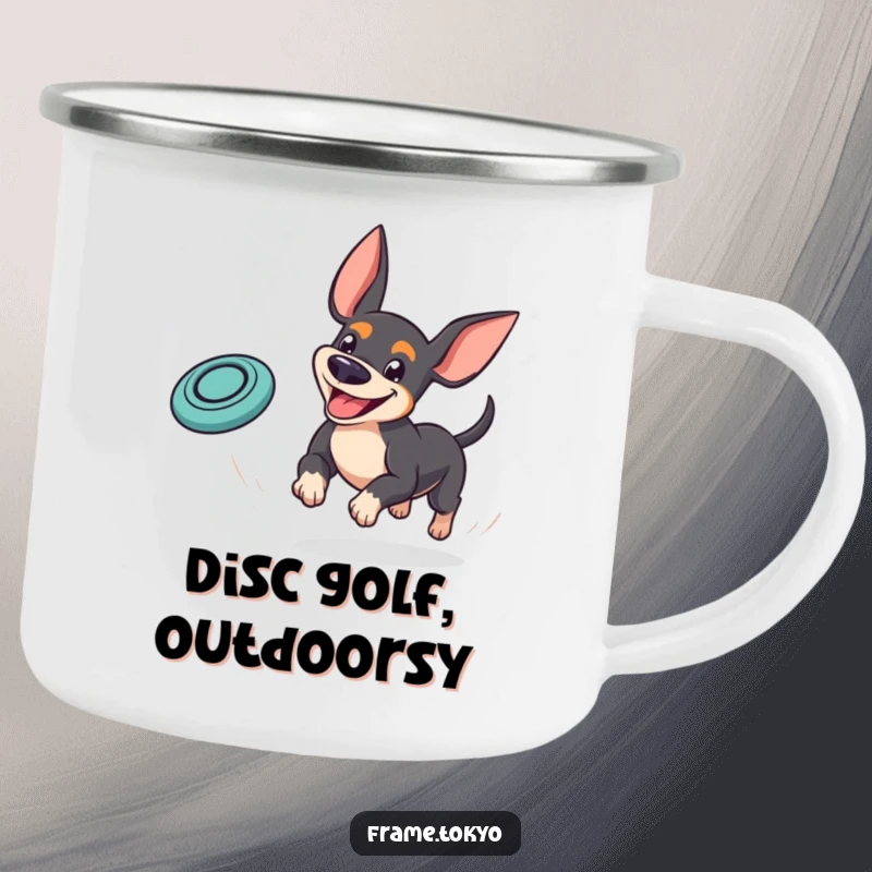 Funny pinscher camping mug showing a dog with a goofy grin playfully chasing a bouncing mini frisbee, perfect for outdoor fun.