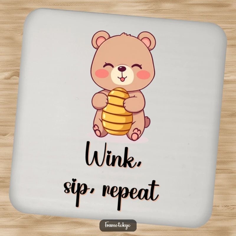 Funny coasters featuring a playful, winking bear balancing a tiny, spinning honey dipper, protecting surfaces with sweet, humorous charm.
