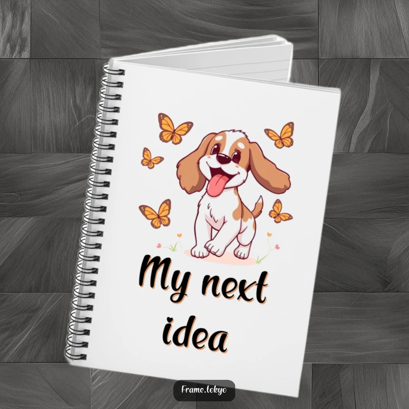 Funny Spaniel Notebook cover showing a spaniel with its tongue lolling out delightedly while chasing animated butterflies.