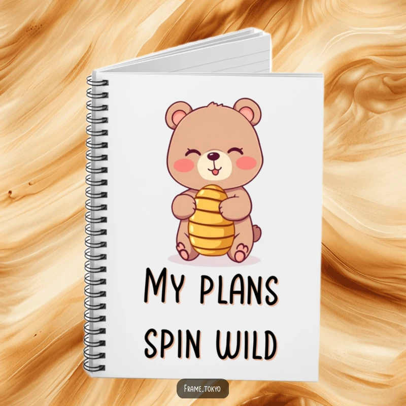 Funny notebook cover featuring a playful, winking bear balancing a tiny, spinning honey dipper, inspiring notes with sweet humor.