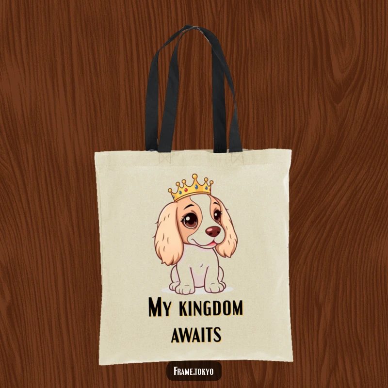 Funny Spaniel Tote Bag depicting a spaniel with a mischievous twinkle in its eye, wearing a small, regal crown.
