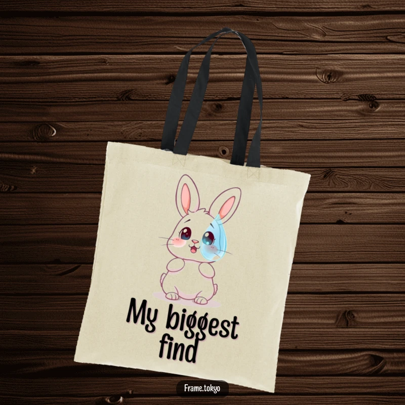 Funny tote bag showing a rabbit with a surprised expression gazing at a large, floating dewdrop, perfect for daily use.